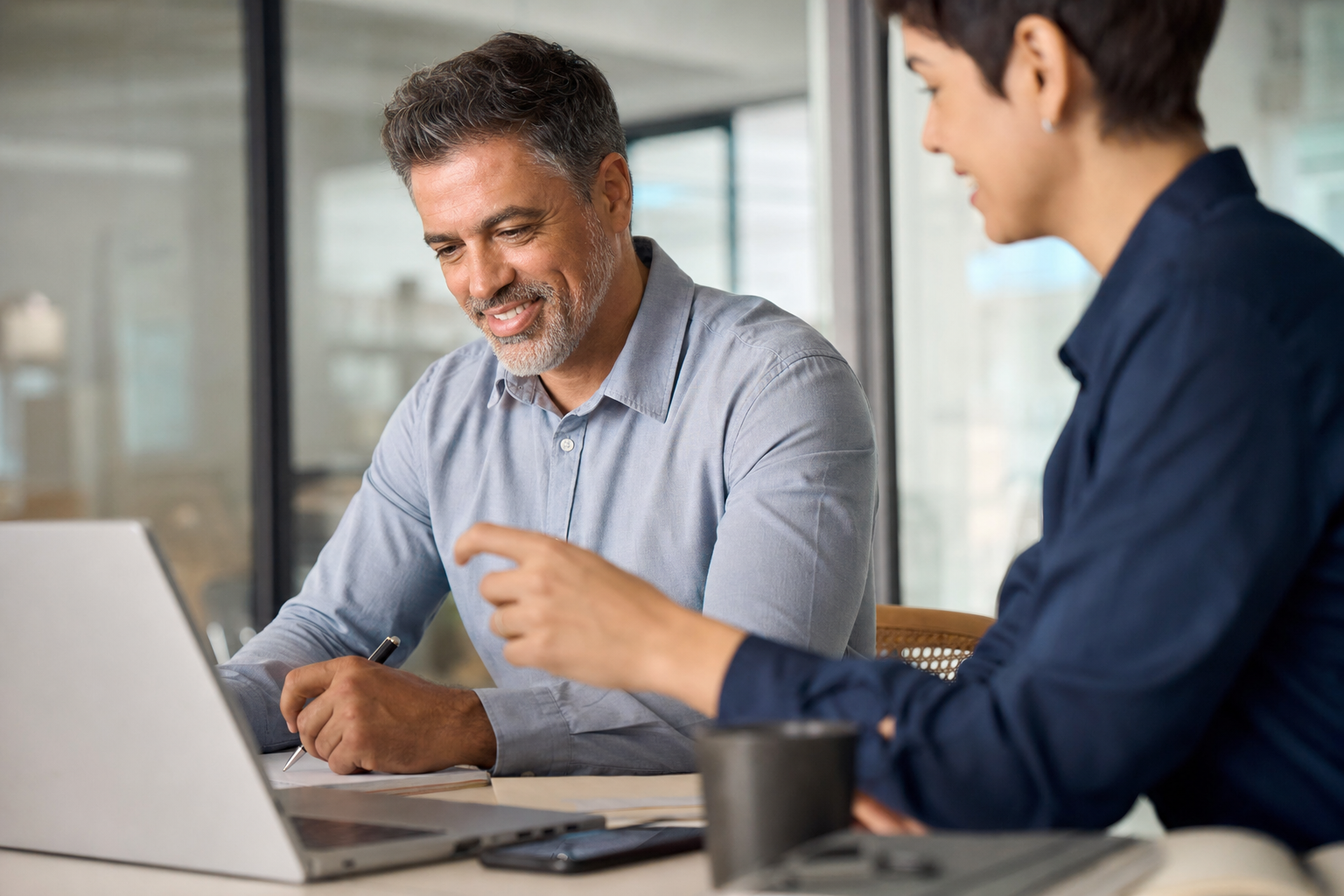 Business owner meeting with a consultant in an office